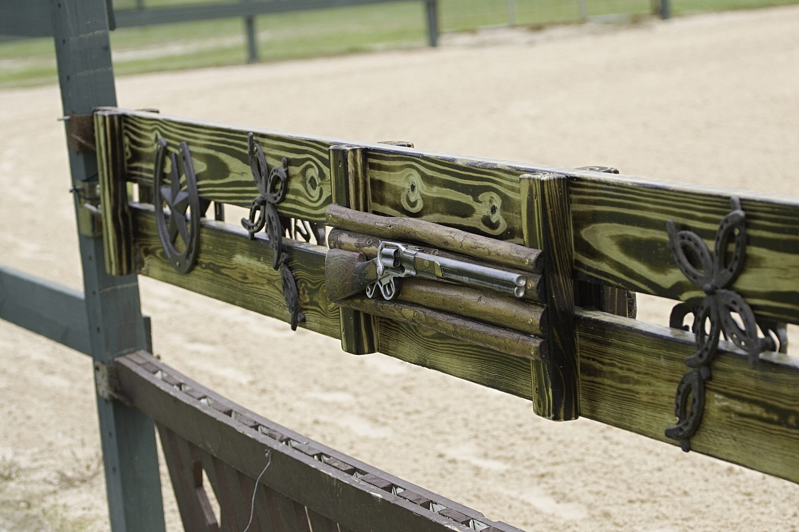 A wooden fence with some metal parts on it