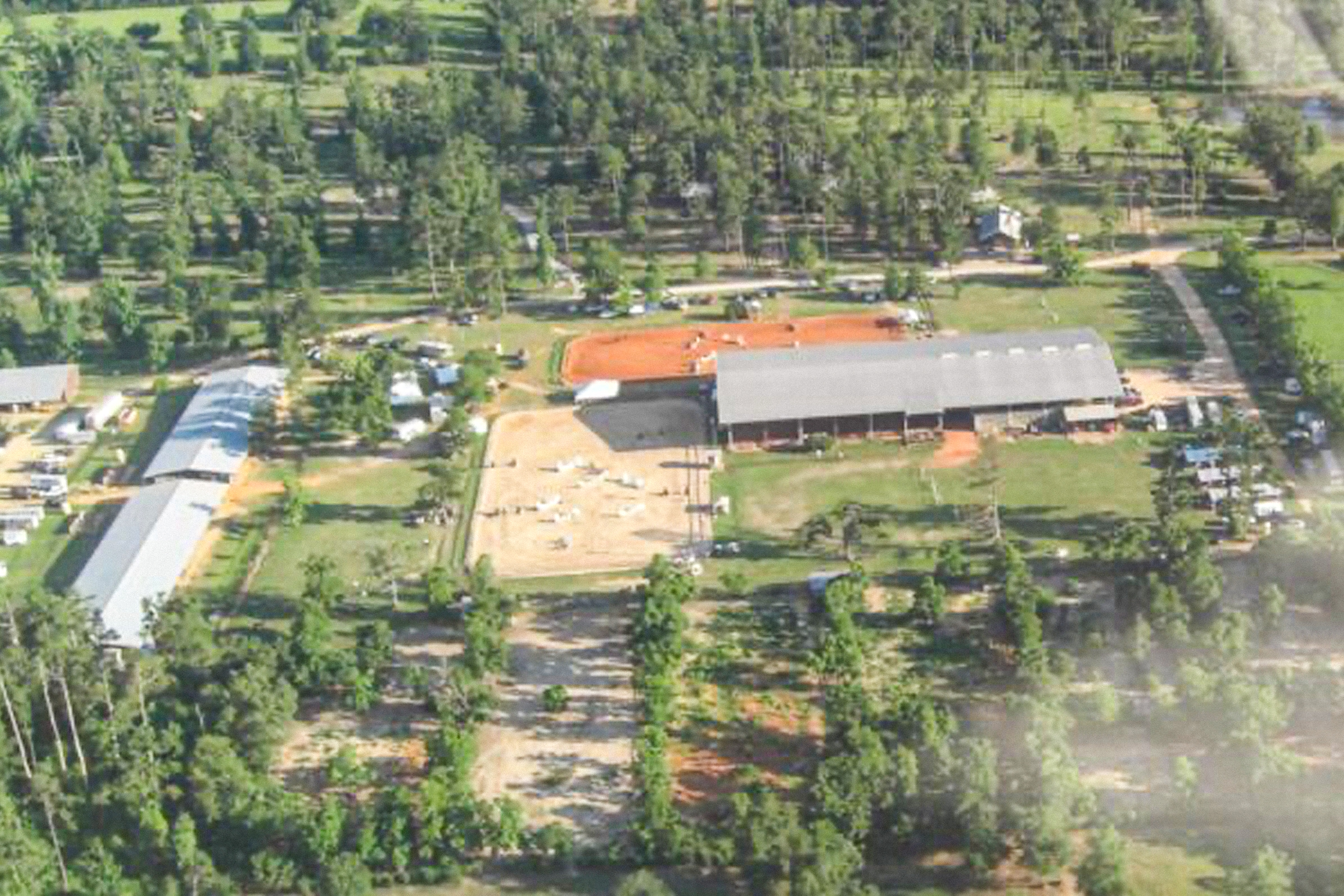 An aerial view of a farm with many buildings.